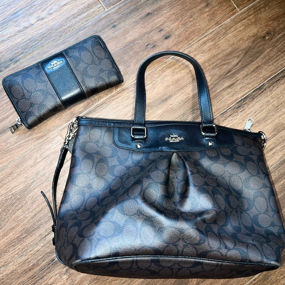 Brown and black coach purse with wallet.